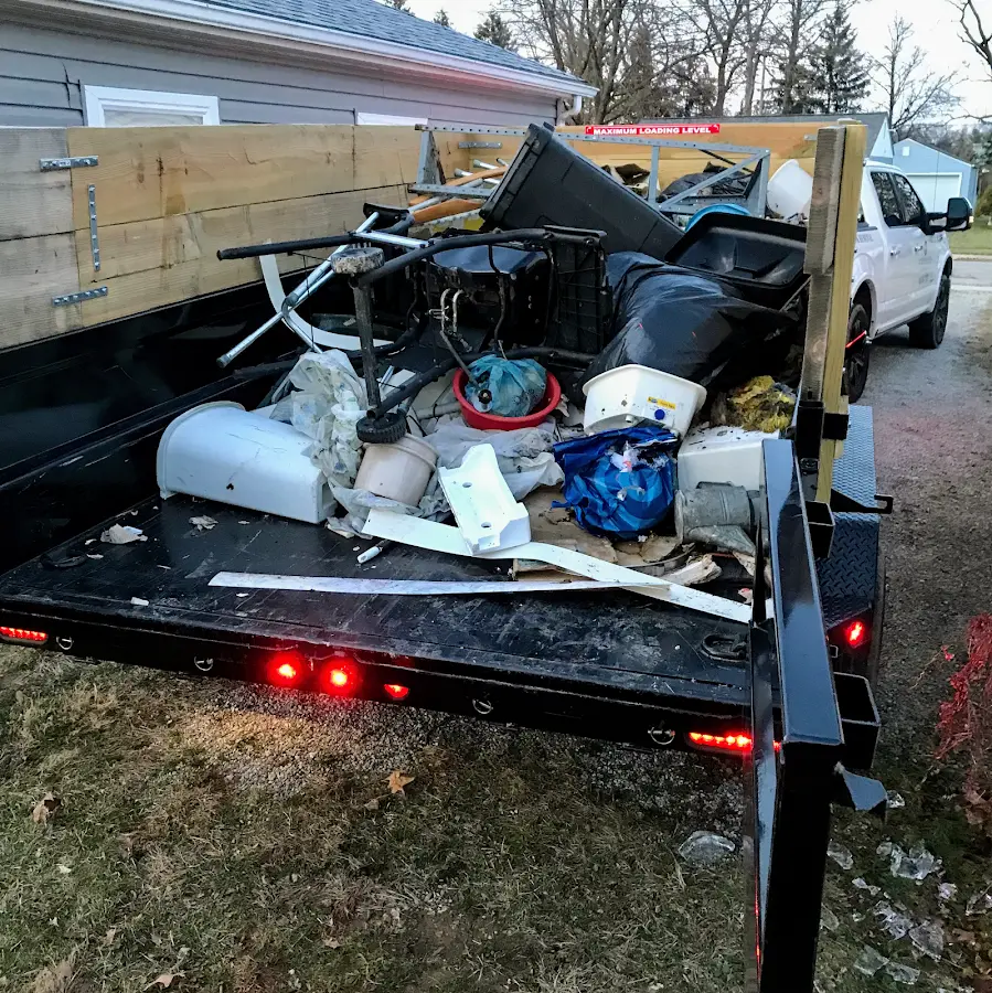 Roll-off dumpster delivered to a residential driveway in Opa-locka